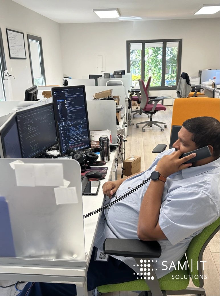 Team collaborating on IT solutions, showcasing Project-Based IT Staffing to enhance project capacity efficiently.